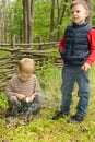 Two young boys learning survival skills Royalty Free Stock Photo