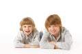 Two Young Boys Lying On Stomach Royalty Free Stock Photo