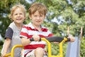 Two Young Boys Playing on Bike