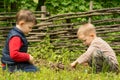 Two young boys playing at lighting a campfire Royalty Free Stock Photo