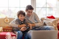 Two Brothers Playing Computer Games at Christmas Time Royalty Free Stock Photo