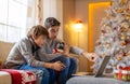 Two Brothers Playing Computer Games at Christmas Time Royalty Free Stock Photo