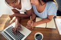 Two young business colleagues working on a laptop Royalty Free Stock Photo