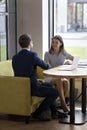 Two young business partners shake hands making deal Royalty Free Stock Photo