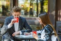 Two young business people using digital tablet on a meeting at coffee shop Royalty Free Stock Photo