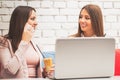 Two young business women working together on laptop Royalty Free Stock Photo