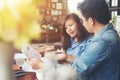 Two young business working on their laptop, While sitting in a c Royalty Free Stock Photo