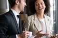 Two young businesspeople having a successful meeting at restaurant. Royalty Free Stock Photo