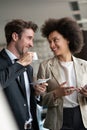 Two young businesspeople having a successful meeting at restaurant. Royalty Free Stock Photo