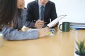 Two businesspeople working with digital tablet and discussing a new project at office. Royalty Free Stock Photo