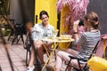 Two young businesswomen sitting on nice decorated terrace Royalty Free Stock Photo