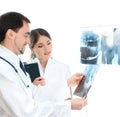 Two young Caucasian doctors holding x-rays Royalty Free Stock Photo