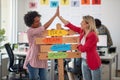 Two young cheerful female office worker are having a good time while posing for a photo and promoting company slogans in the Royalty Free Stock Photo