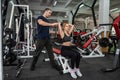 two young cheerful second girl and boy walk together in the gym to get in shape. Royalty Free Stock Photo