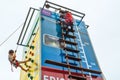 Children reaching the top of a climbing tower Royalty Free Stock Photo