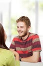 Two young college students studying together in class sitting Royalty Free Stock Photo