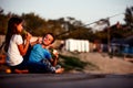 Two young cute little friends, boy and girl eating sandwiches and fishing, boy  shoving gesture thumb up Royalty Free Stock Photo