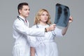 Two young doctors looking at the x-ray picture of lungs Royalty Free Stock Photo