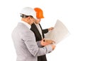 Two young engineers discussing a building plan Royalty Free Stock Photo