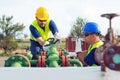 Two engineers working inside oil and gas refinery Royalty Free Stock Photo