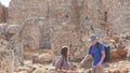 Two young archaeologists exploring ancient city