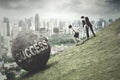 Entrepreneurs pull boulder with Success word Royalty Free Stock Photo