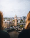 Two young females taking in the view of the iconic Big Ben clock tower in London, England Royalty Free Stock Photo