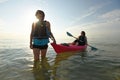 Two young fit women in kayak