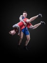 Two young freestyle wrestlers isolated on black background Royalty Free Stock Photo