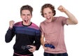 Two young friends playing video games and holding gamepads. Tourney or tournament concept Royalty Free Stock Photo