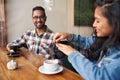 Two young friends talking together over coffee in a cafe Royalty Free Stock Photo