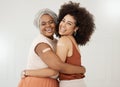 Two young friends wearing and showing a bandaid on their arms standing against a white wall together at work. Happy Royalty Free Stock Photo