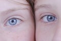Two young girl eyes, they are looking at the camera, portrait children, macro, indoors