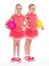 Two young girl gymnast with sports balls. Royalty Free Stock Photo