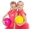 Two young girl gymnast with sports balls. Royalty Free Stock Photo