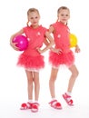 Two young girl gymnast with sports balls. Royalty Free Stock Photo