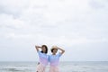 Two young girl having fun at beautiful beach