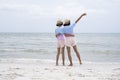 Two young girl having fun at beautiful beach