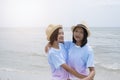 Two young girl having fun at beautiful beach