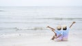 Two young girl playing Ukulele at beautiful beach sea background Royalty Free Stock Photo