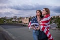 Two young girl wrapped in american flag Royalty Free Stock Photo