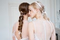 Two young girls of the bride embrace. New collection of wedding dresses for women. Wedding ceremony, the happiest day of your life