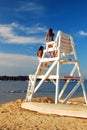 Two young girls chat at the seashore