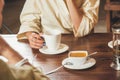 Two young girls are drinking green tea with honey after bathing spa procedures at the table. Concept - tea drinking after Royalty Free Stock Photo