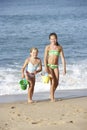 Two Young Girls Enjoying Beach Holiday Royalty Free Stock Photo