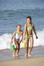 Two Young Girls Enjoying Beach Holiday Royalty Free Stock Photo