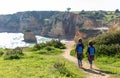 Two young girls exploring Portuguese coastline