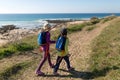 Two young girls exploring Spanish coastline