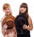 Two young girls with hats, vintage style Royalty Free Stock Photo