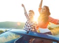 Two young girls having fun in the cabriolet outdoors Royalty Free Stock Photo